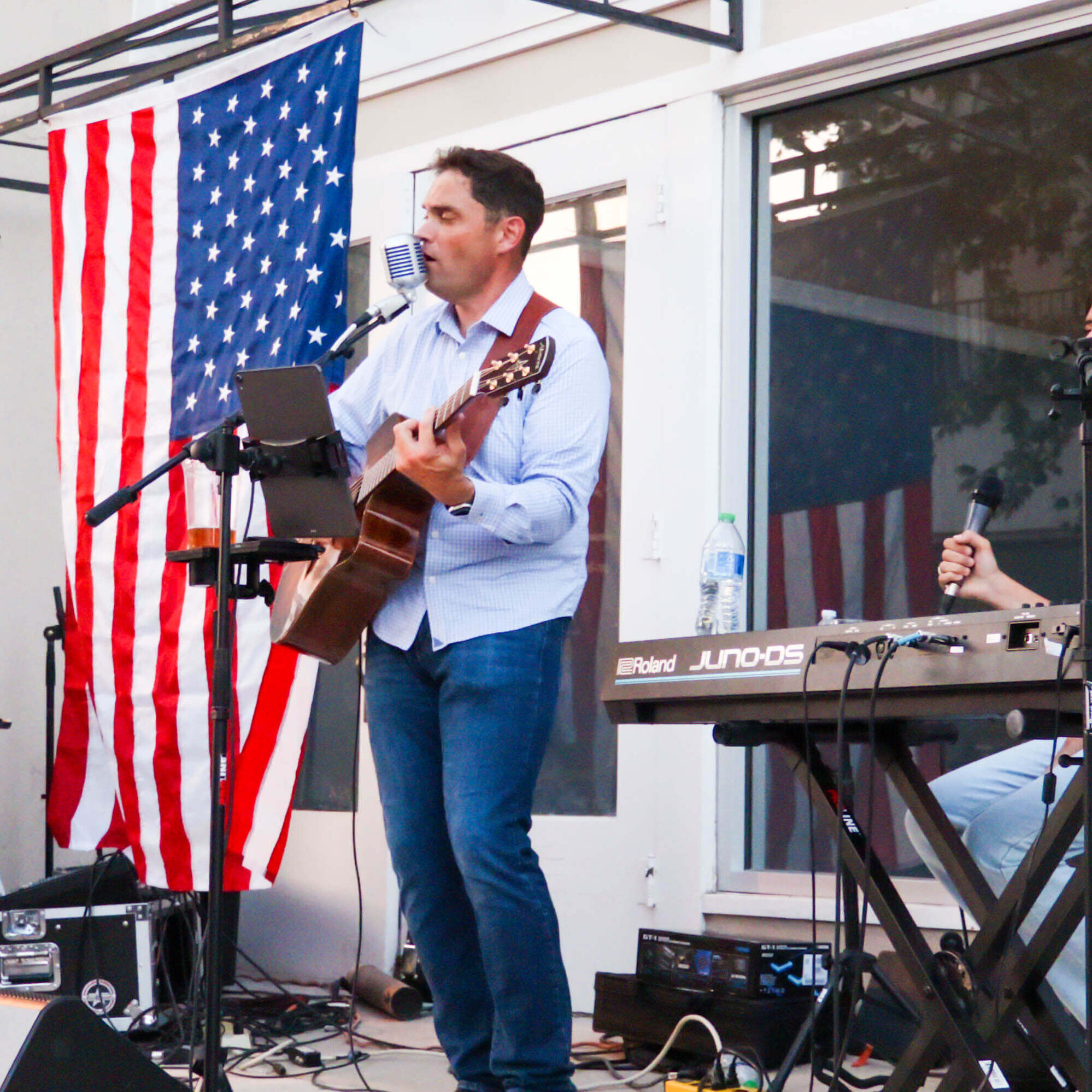 Performer in front of American flag